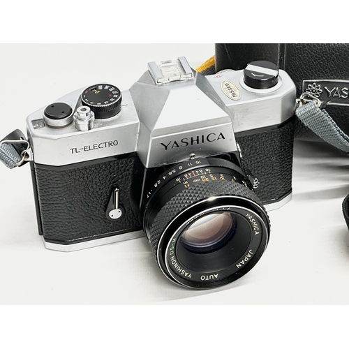 911 - A Yashica TL-Electro camera with case.