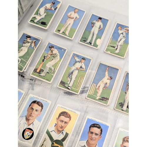 937 - A quantity of cigarette cards, World War II battleships including HMS Hood, etc. Cricketers, includi... 