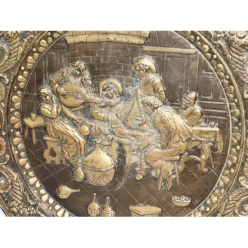 972 - A Late 19th Century Victorian embossed brass wall plaque tray. 62cm.