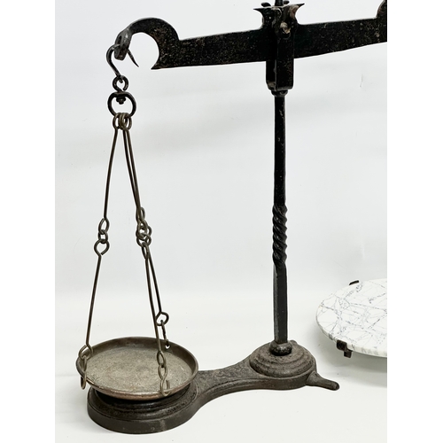 581A - A large Late 19th Century cast iron shops balance scales. 70x67cm