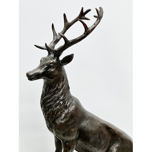 3 - A pair of large bronze stags on marble bases, after J. Moignier. 34x19x66cm