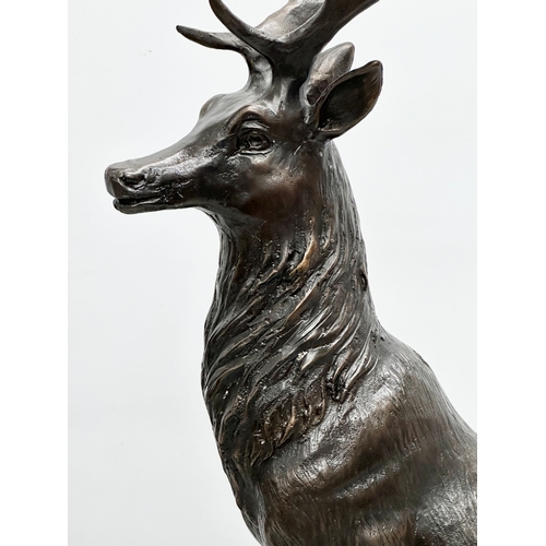 3 - A pair of large bronze stags on marble bases, after J. Moignier. 34x19x66cm