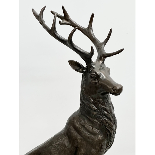 3 - A pair of large bronze stags on marble bases, after J. Moignier. 34x19x66cm