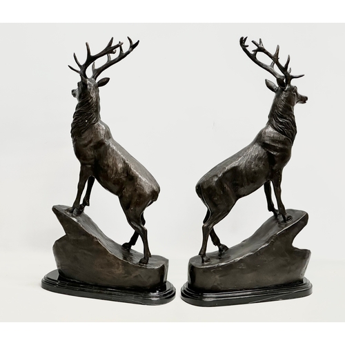 3 - A pair of large bronze stags on marble bases, after J. Moignier. 34x19x66cm