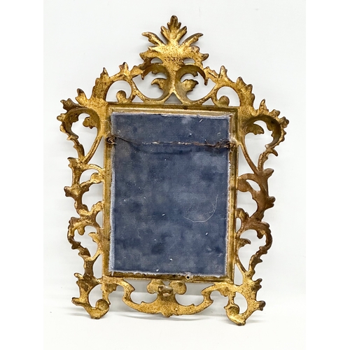 970B - A small 19th Century Victorian brass framed rococo style mirror. 22x30cm.