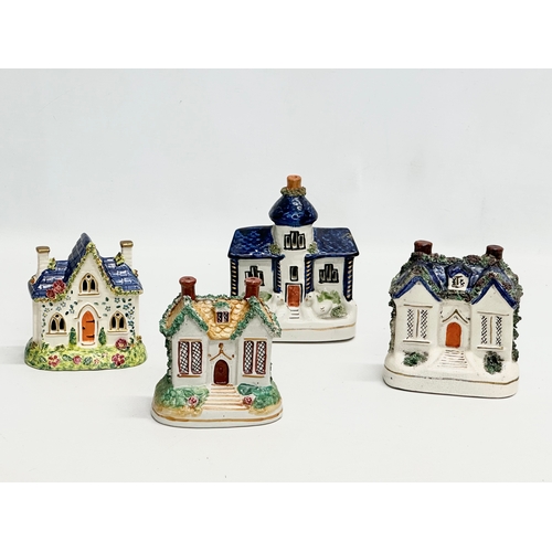 388 - Four 19th Century Victorian Staffordshire Pottery cottages. 12x16cm. 11x13cm.