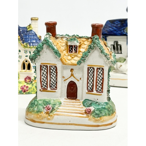 388 - Four 19th Century Victorian Staffordshire Pottery cottages. 12x16cm. 11x13cm.