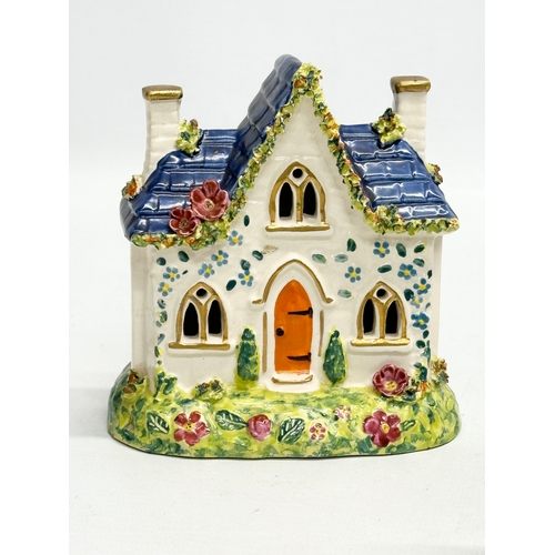 388 - Four 19th Century Victorian Staffordshire Pottery cottages. 12x16cm. 11x13cm.