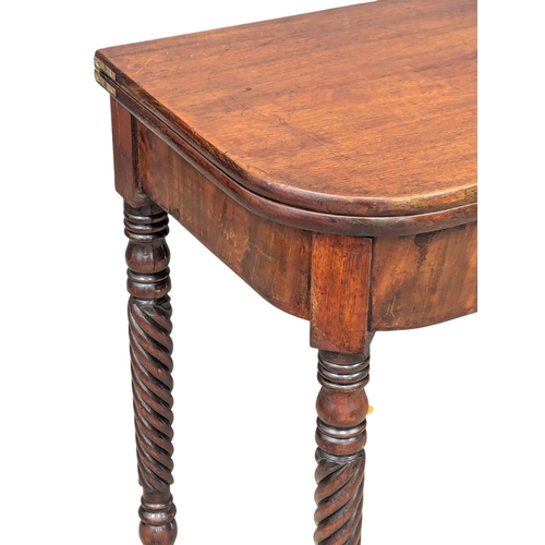 882 - An Early 19th Century George IV mahogany turnover tea table on writhing legs. 95x47.5x76cm