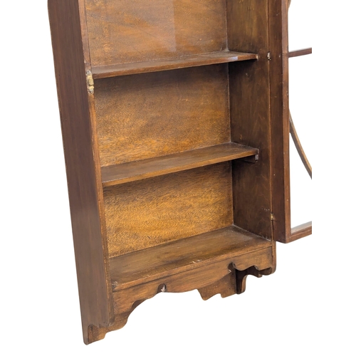 892 - An Edwardian mahogany wall hanging display cabinet. 49x18x107cm