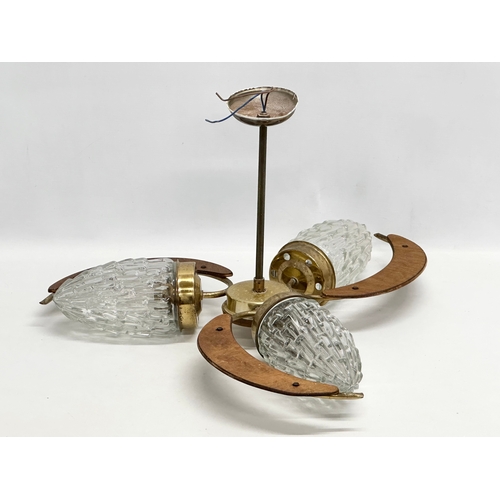 887 - A 1960’s Mid Century teak and brass ceiling light with flamed glass shade. 52x31cm