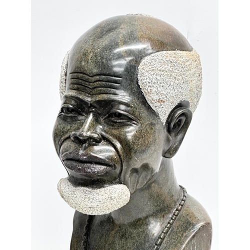 865 - A large African soapstone bust. 45cm