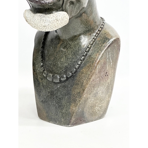 865 - A large African soapstone bust. 45cm