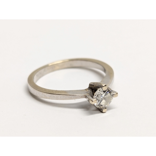 707 - An 18ct white gold solitaire diamond ring.