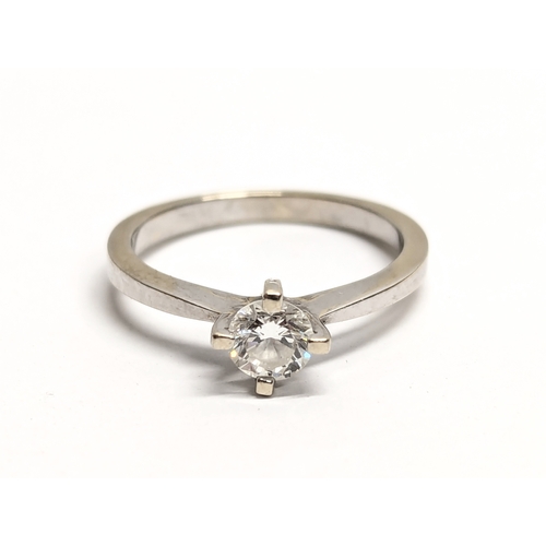 707 - An 18ct white gold solitaire diamond ring.