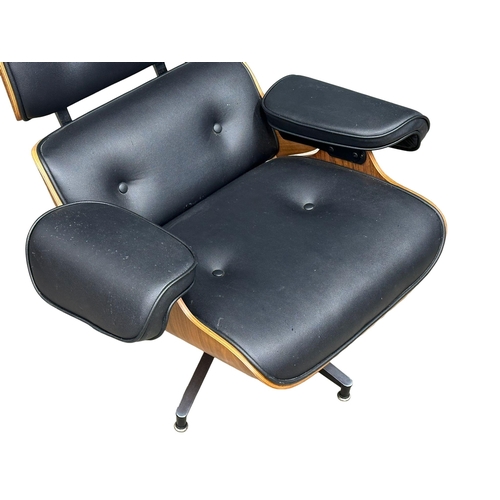 1 - A Charles & Ray Eames style leather swivel armchair and ottoman.