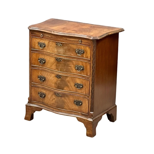 114 - An Early 20th Century Chippendale Revival mahogany serpentine front chest of drawers, with brushing ... 