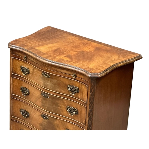 114 - An Early 20th Century Chippendale Revival mahogany serpentine front chest of drawers, with brushing ... 