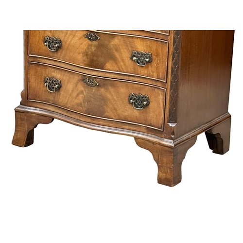 114 - An Early 20th Century Chippendale Revival mahogany serpentine front chest of drawers, with brushing ... 