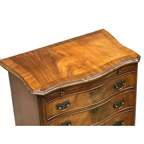 114 - An Early 20th Century Chippendale Revival mahogany serpentine front chest of drawers, with brushing ... 