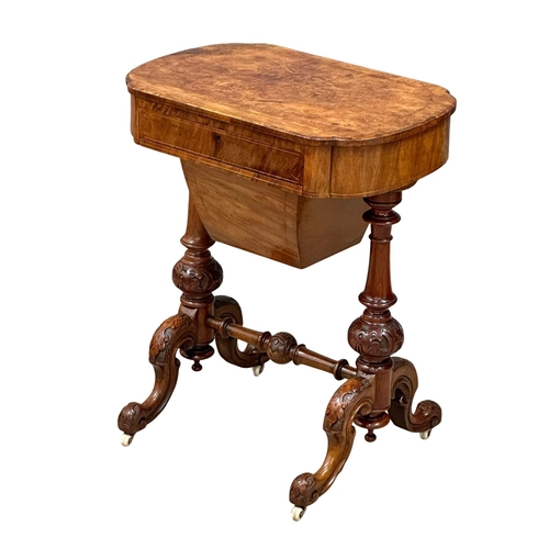 117 - A 19th Century Victorian inlaid walnut work table/side table with maple interior and cared base on c... 