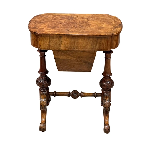 117 - A 19th Century Victorian inlaid walnut work table/side table with maple interior and cared base on c... 