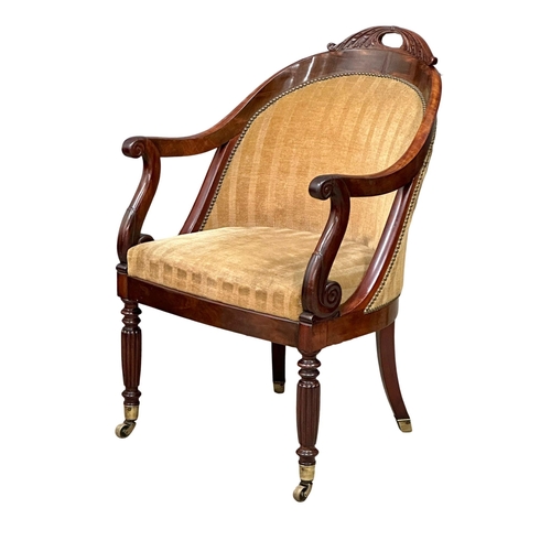 13 - An Early 19th Century Late George IV mahogany library chair/armchair, on reeded legs and brass cup c... 