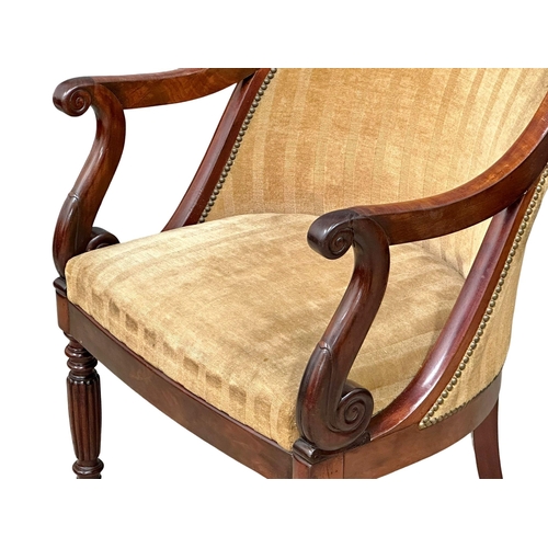 13 - An Early 19th Century Late George IV mahogany library chair/armchair, on reeded legs and brass cup c... 