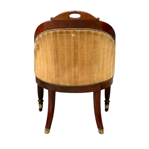 13 - An Early 19th Century Late George IV mahogany library chair/armchair, on reeded legs and brass cup c... 