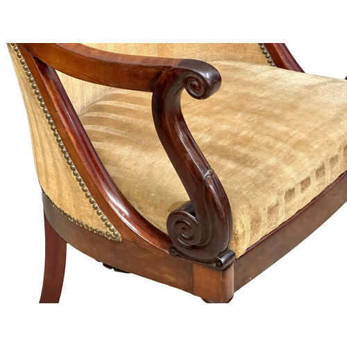 13 - An Early 19th Century Late George IV mahogany library chair/armchair, on reeded legs and brass cup c... 