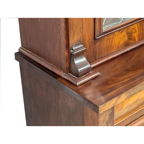 158 - A large 19th Century Victorian mahogany bookcase, with lead glass doors . 122x50x226cm