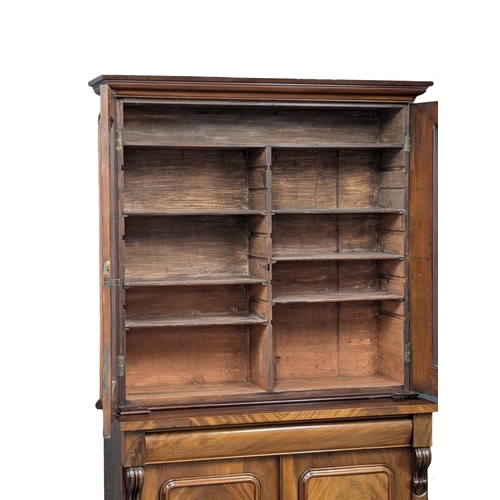 158 - A large 19th Century Victorian mahogany bookcase, with lead glass doors . 122x50x226cm