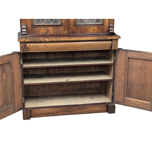 158 - A large 19th Century Victorian mahogany bookcase, with lead glass doors . 122x50x226cm