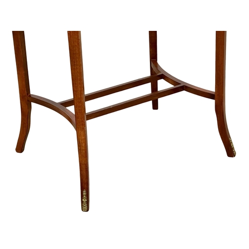 176 - An inlaid mahogany bijouterie table with brass mounts. Display table. 59x46x75cm