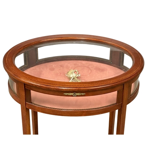 176 - An inlaid mahogany bijouterie table with brass mounts. Display table. 59x46x75cm