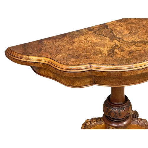 200 - A 19th Century Victorian burr walnut turnover games table with pedestal base. 98x102x72cm.