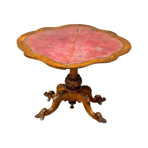 200 - A 19th Century Victorian burr walnut turnover games table with pedestal base. 98x102x72cm.