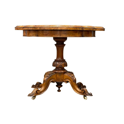 200 - A 19th Century Victorian burr walnut turnover games table with pedestal base. 98x102x72cm.