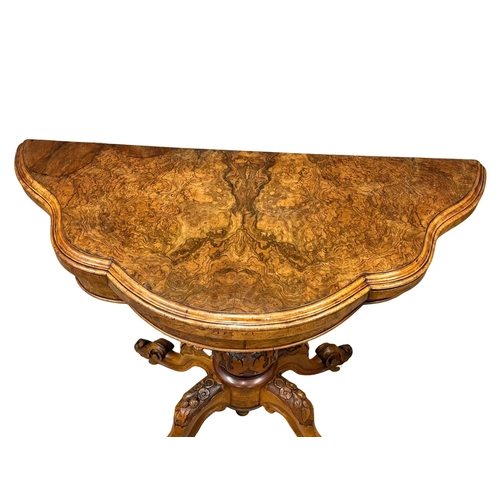 200 - A 19th Century Victorian burr walnut turnover games table with pedestal base. 98x102x72cm.