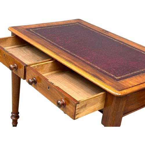 221 - A 19th Century Victorian mahogany writing table, with 2 drawers, leather top and turned legs. Circa ... 