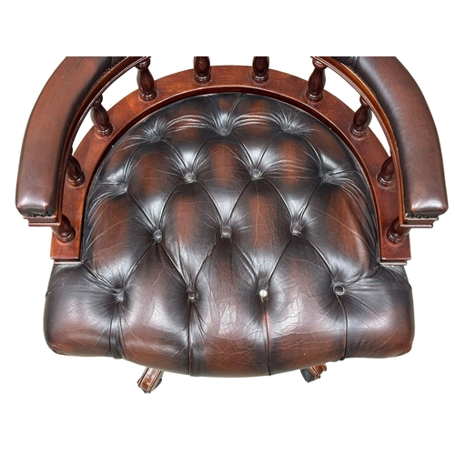 222 - A deep button leather swivel desk chair.