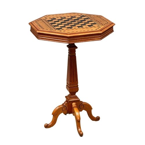 227 - A nice quality Early 20th Century inlaid walnut tilt top games table with pedestal base. 55x77cm.