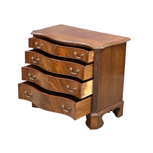 230 - An Early 20th Century Chippendale Revival mahogany serpentine front chest of drawers on bracket feet... 