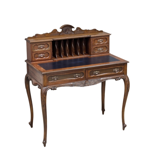 259 - A Late 19th Century mahogany ladies writing desk with 2 front drawers and cabriole legs. Circa 1890.... 