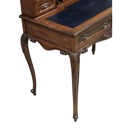 259 - A Late 19th Century mahogany ladies writing desk with 2 front drawers and cabriole legs. Circa 1890.... 