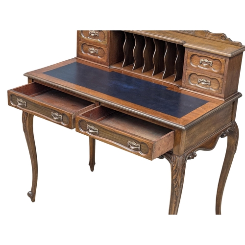 259 - A Late 19th Century mahogany ladies writing desk with 2 front drawers and cabriole legs. Circa 1890.... 