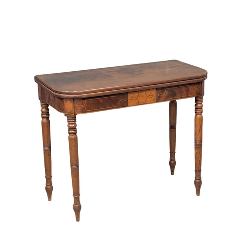 260 - A George IV inlaid mahogany turnover tea table on turned legs. Circa 1820. 90x45x74cm. (2)