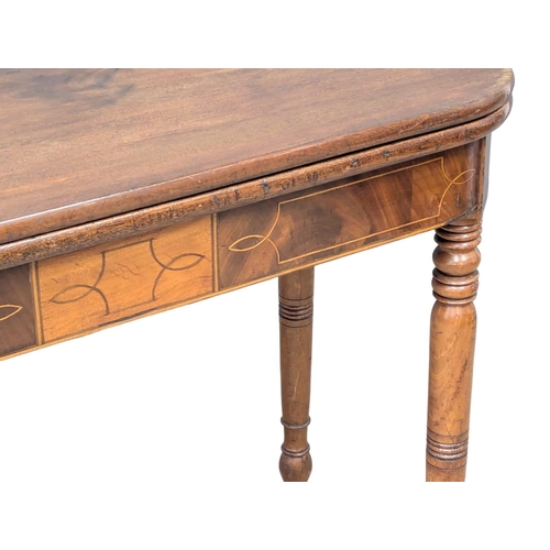 260 - A George IV inlaid mahogany turnover tea table on turned legs. Circa 1820. 90x45x74cm. (2)