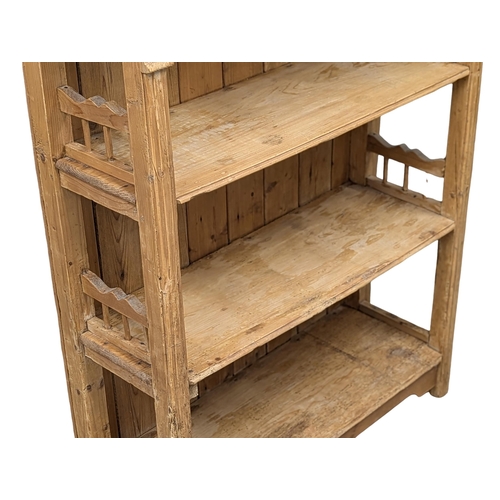 266 - A 19th Century Victorian pine shelving unit. 94.5x33.5x125cm