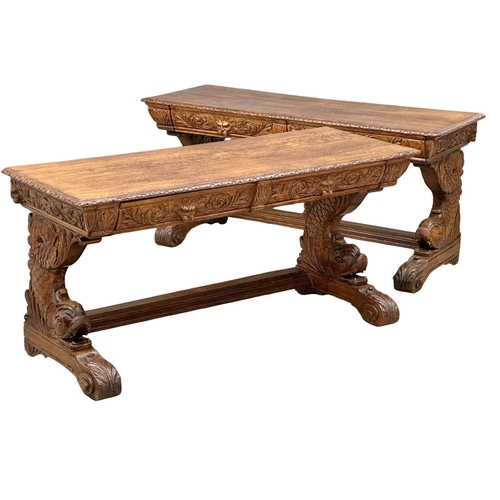 27 - A pair of large 19th Century Victorian carved oak console tables, with man of the forest drawers, ko... 